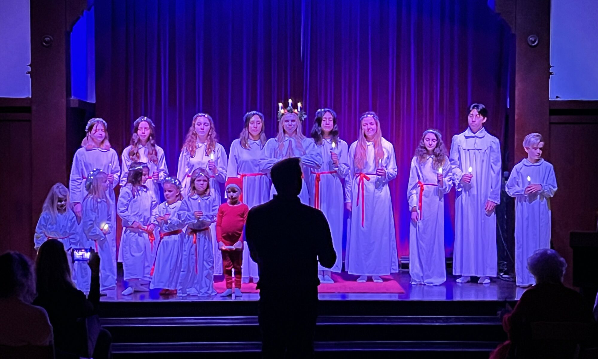 Lucia Choir singing on stage
